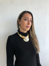 Load image into Gallery viewer, Oval light gold color conch shell pearl necklace and matching earrings.