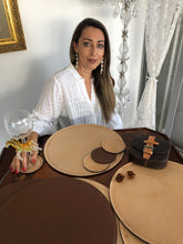 Load image into Gallery viewer, Saddle color leather reversible round placemats and coasters.