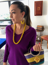 Load image into Gallery viewer, Kelly yellow paja toquilla necklace, large hoop post earrings and small rose earrings.