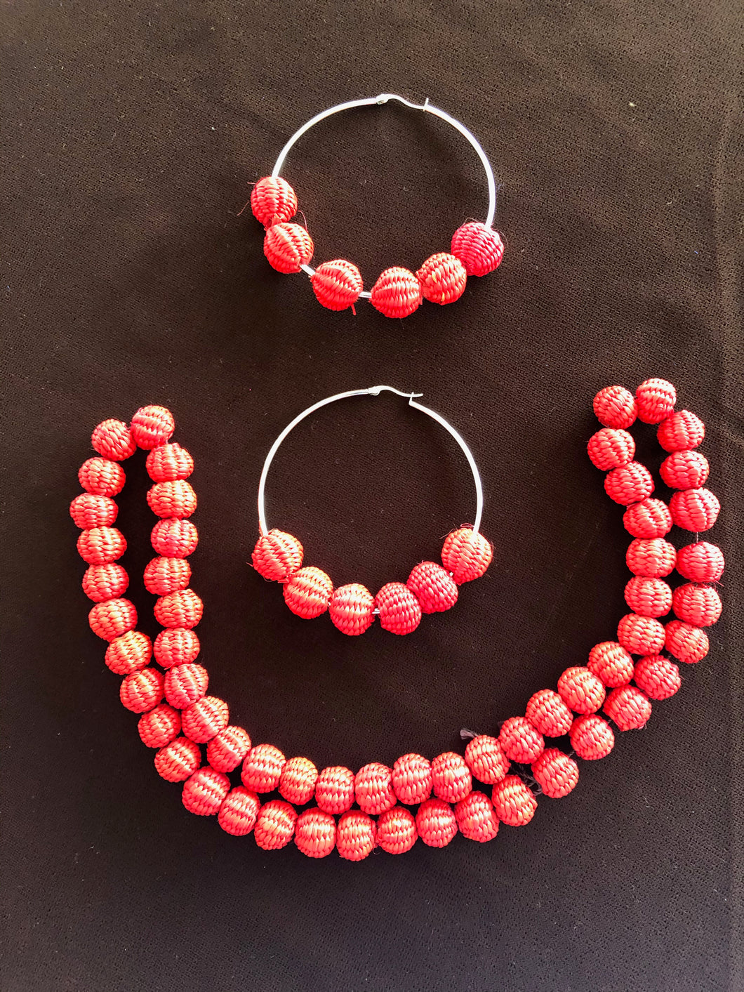 Kathy red paja toquilla necklace and large hoop matching earrings.