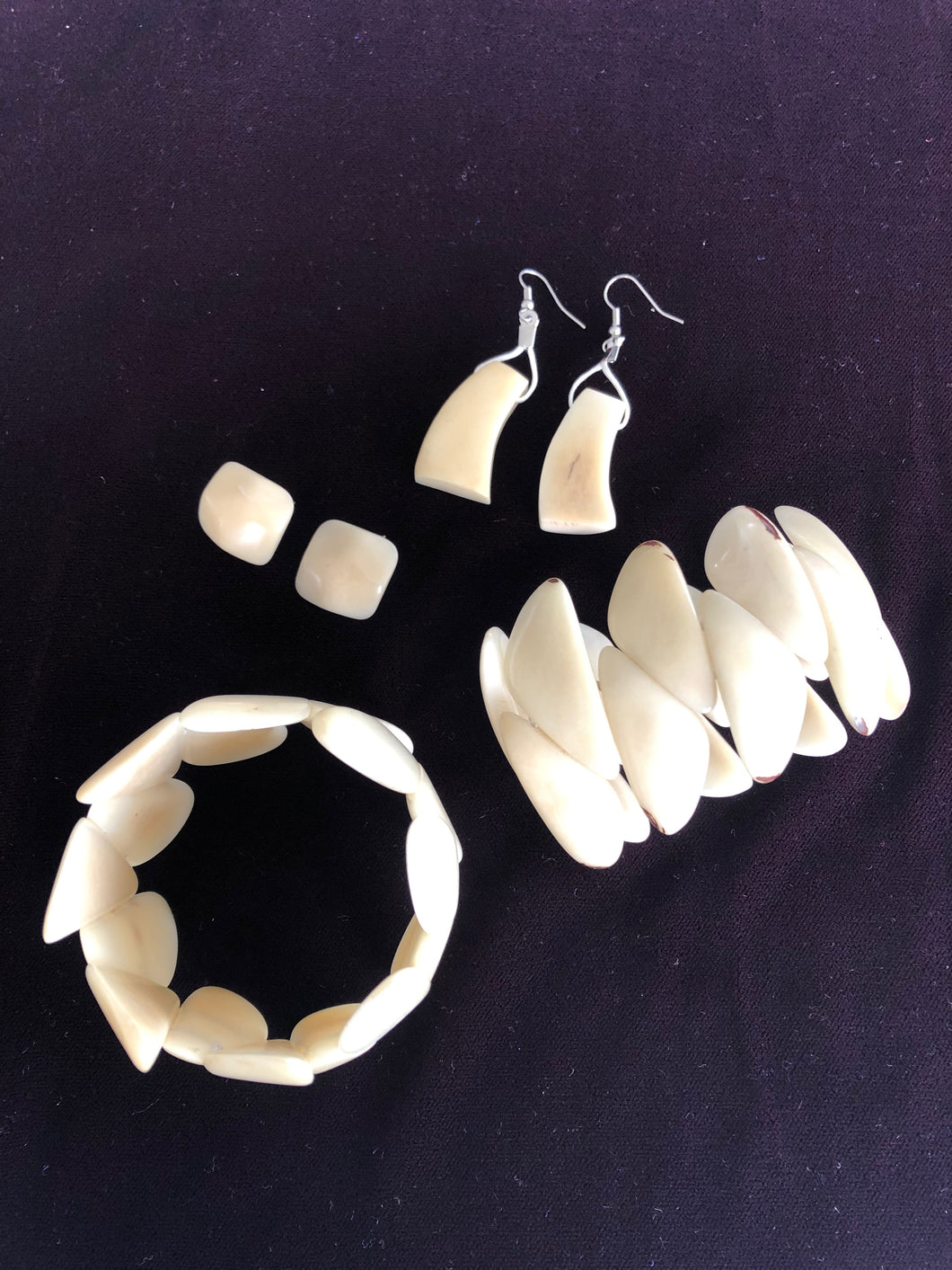 Sofia beige spiral tagua twin cuff bracelets and matching earrings.