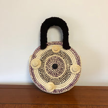 Load image into Gallery viewer, Olivia paja toquilla round basket bag with paja toquilla and velvet embellishments.
