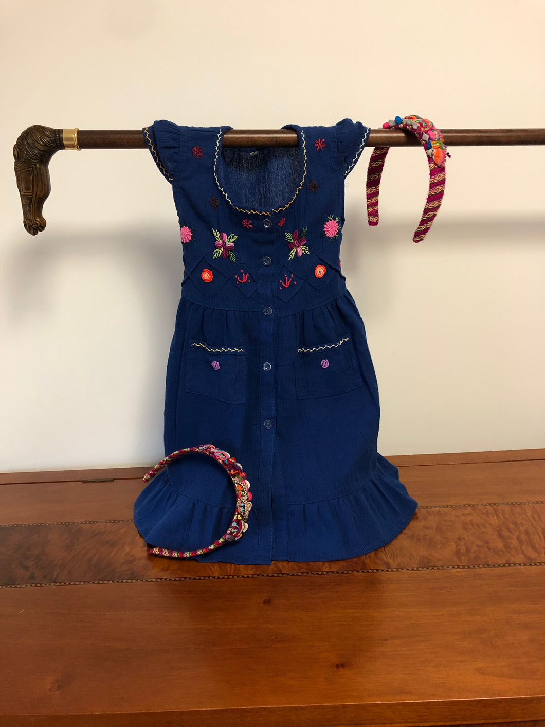 Salome girl embroidered colorful dress with two front pockets and matching headband.