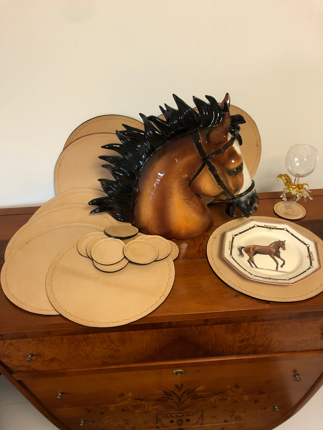 Saddle color leather reversible round placemats and coasters.