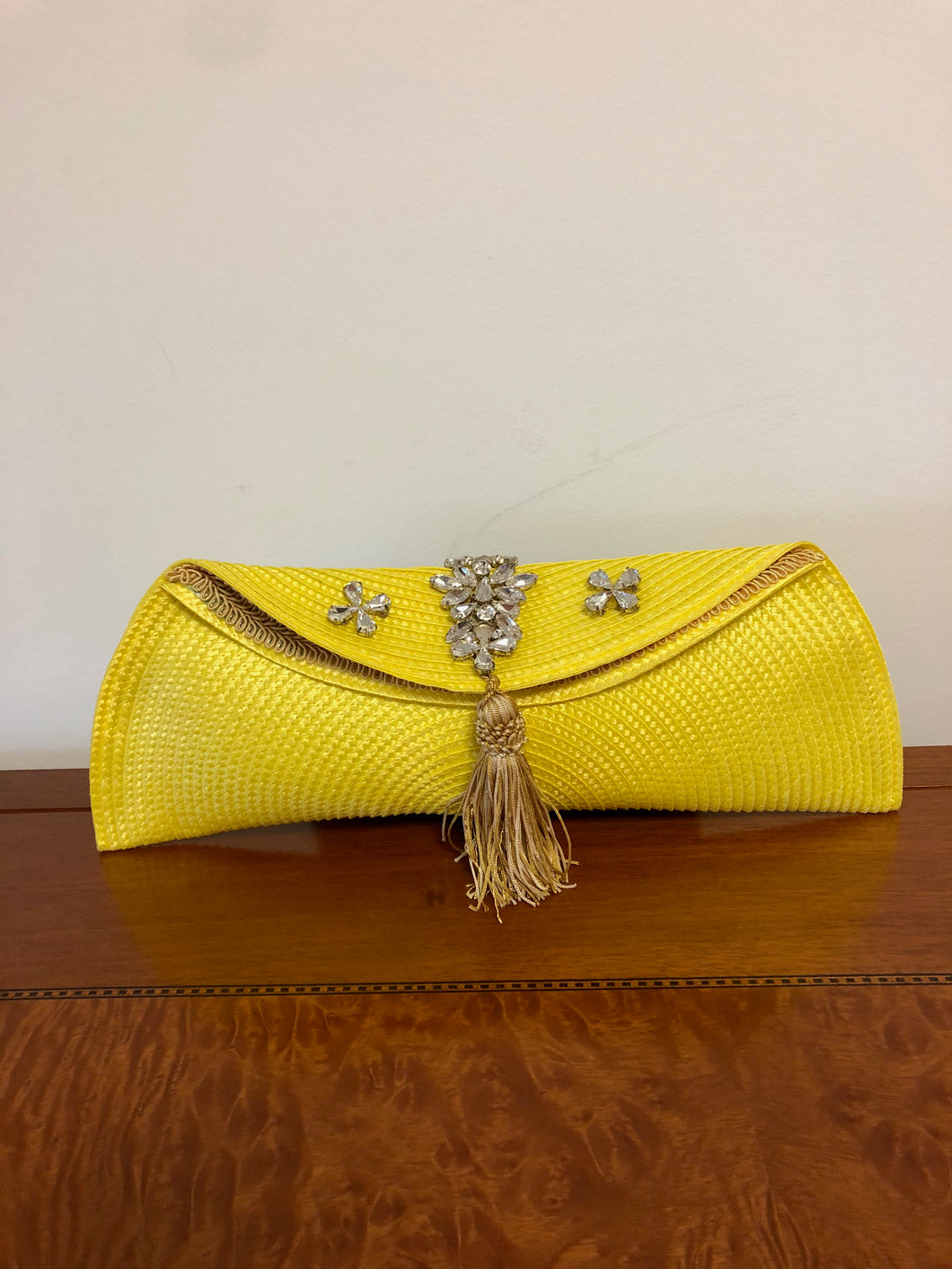 Yellow classy and functional polypropylene fabric clutch bag.