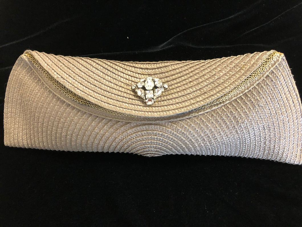 Beige classy and functional polypropylene clutch bag.