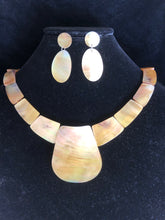 Load image into Gallery viewer, Oval light gold color conch shell pearl necklace and matching earrings.
